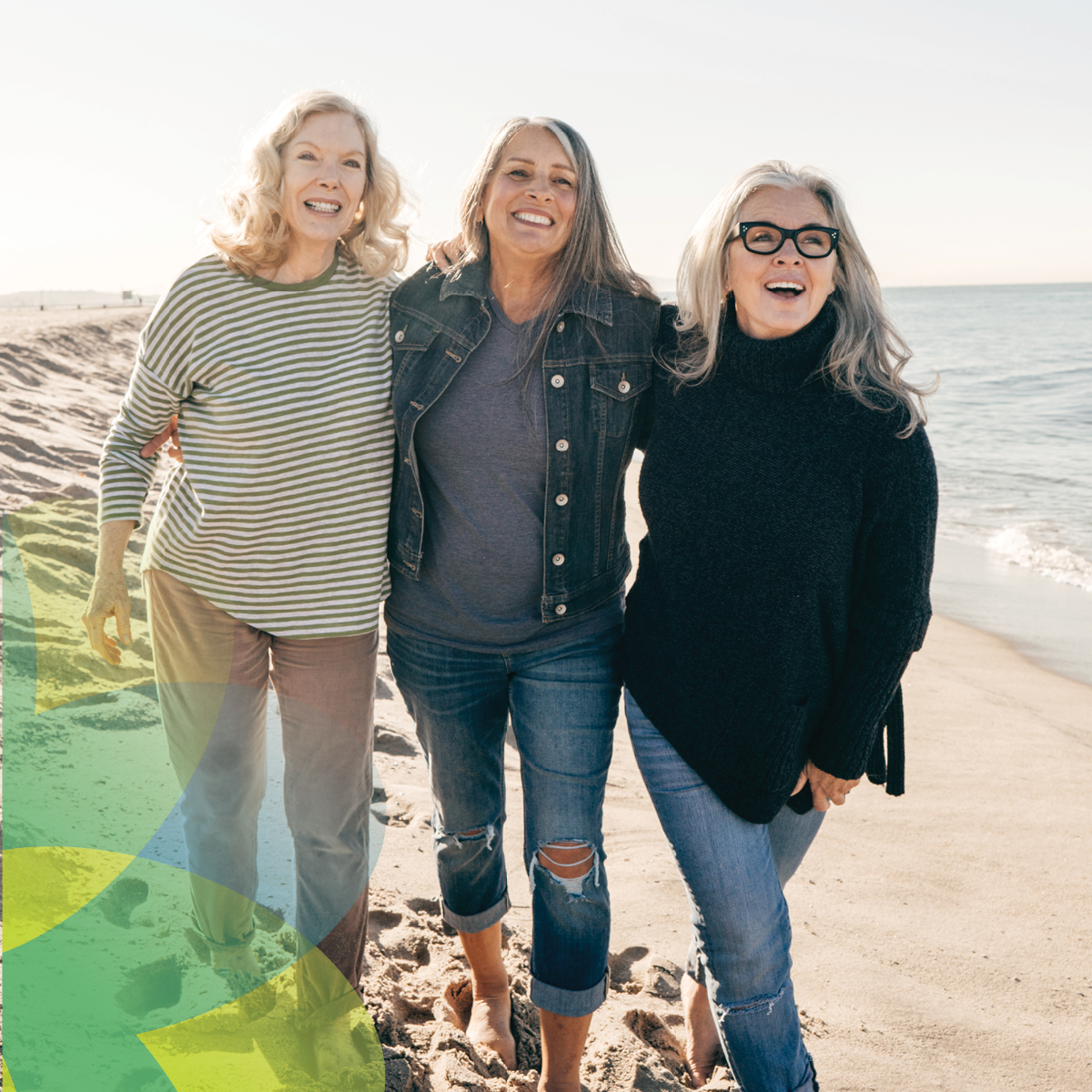 ChristianaCare My65+ ad featuring three older women walking arm-in-arm on a sunny beach. They are smiling and enjoying the day. The ocean is visible in the background with clear skies.